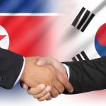 Shaking hands of South Korea and North Korea